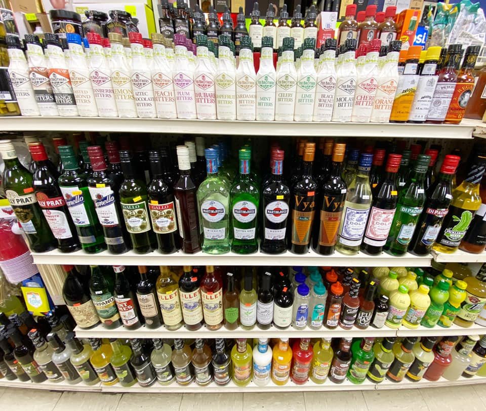 Bitters and cocktail mixers on the shelf at Benstein Liquor