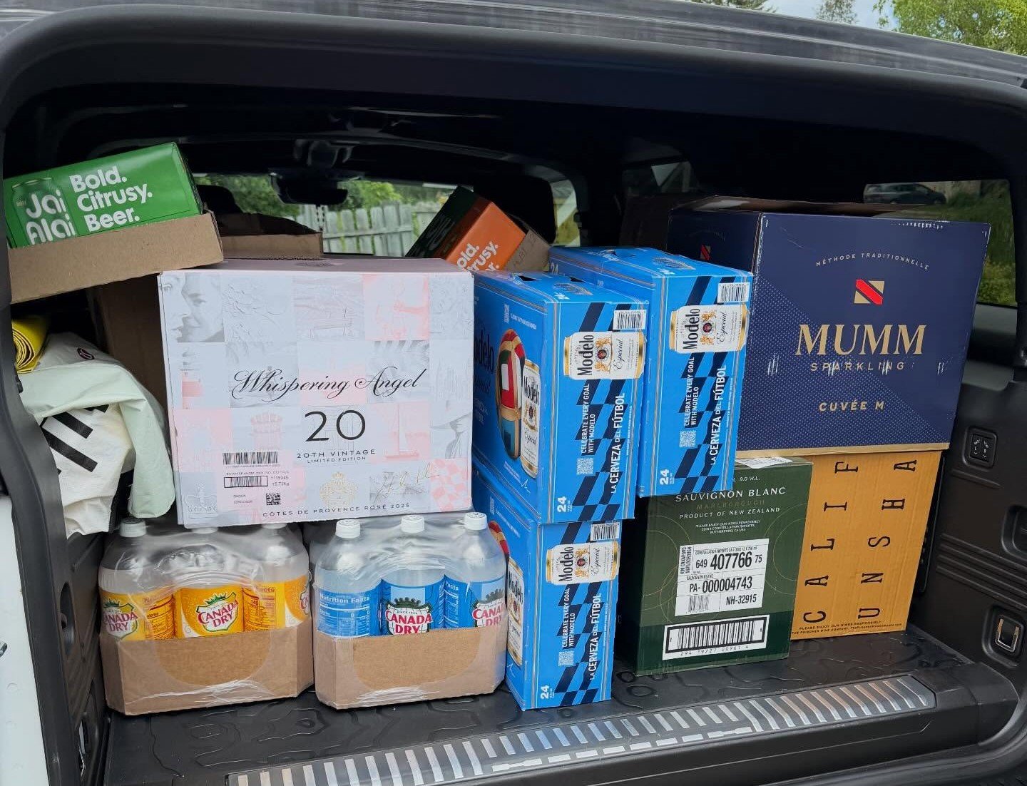 A curated case of wine, beer, and spirits packed for an event
